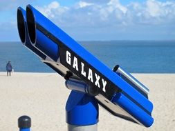 blue telescope on the beach