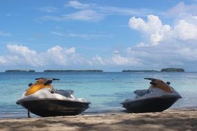 two water scooters on beach at sea, indonesia, jakarta, pulau seribu