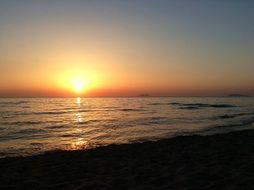bright yellow sun over the sea at sunset