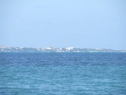 view from the water of the mountain coast
