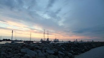 sailboats near the shore in the evening