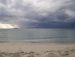 dark clouds over the ocean in corsica