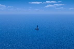 yacht in the endless blue sea