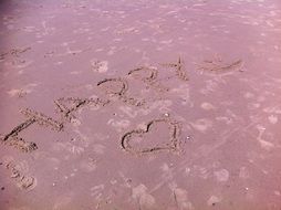 inscriptions on the sandy beach