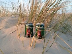 beer cans on the beach
