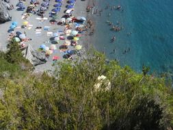 View from above to the crowded beach of Calabria