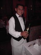 waiter with a bottle in his hand