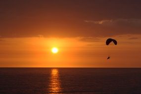 Paratrooper sunset sun sea view