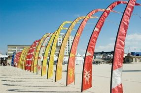 arched flags on the beach