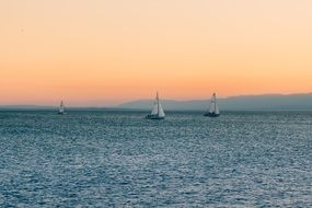 distant view of sailboats on a lake