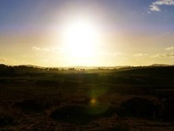 sunlight over green fields