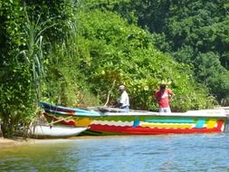 men on a colorful boat in sri lanka