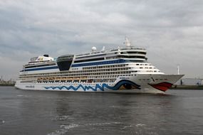 driving a cruise ship on the water in hamburg