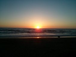 sunset over the ocean horizon in chile
