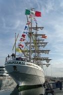 sailboat with a Mexican flag in the port