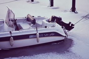 frozen motor boat in ice