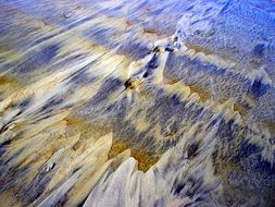 colorful sand on the North Sea close-up