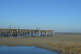 beach sea wooden pier breakwater water