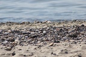pebbles and gray sand by the ocean