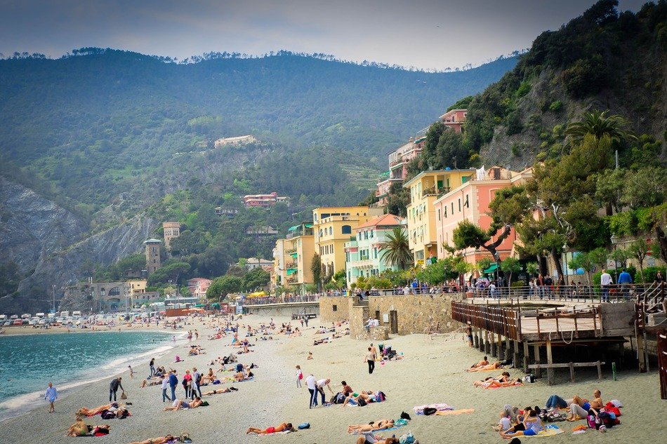 people on the beach in Cinque Terre in Italy