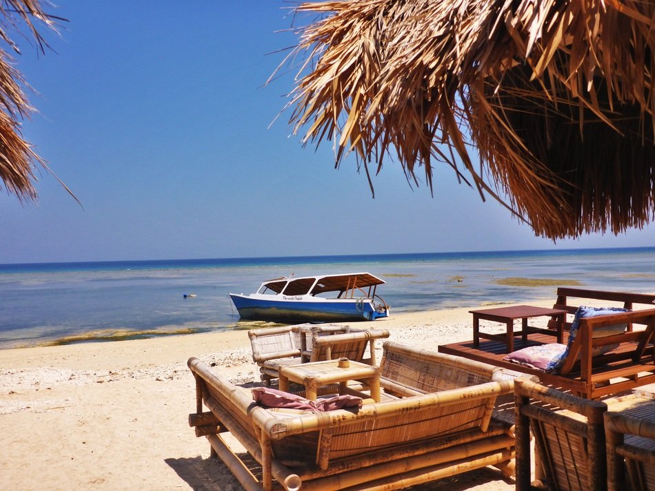 bamboo and wooden gazeboes on beach, indonesia