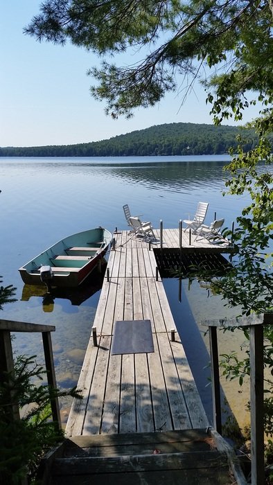 wooden pier on the lake in the village