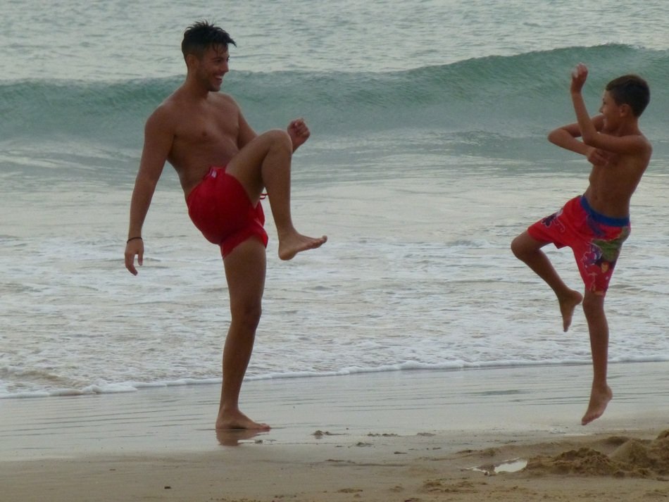 happy brothers on the beach