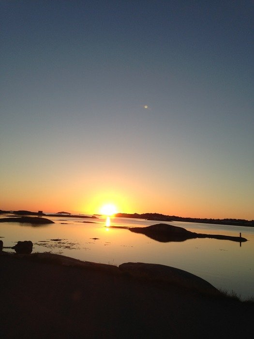 sunset on the horizon in the blue sky