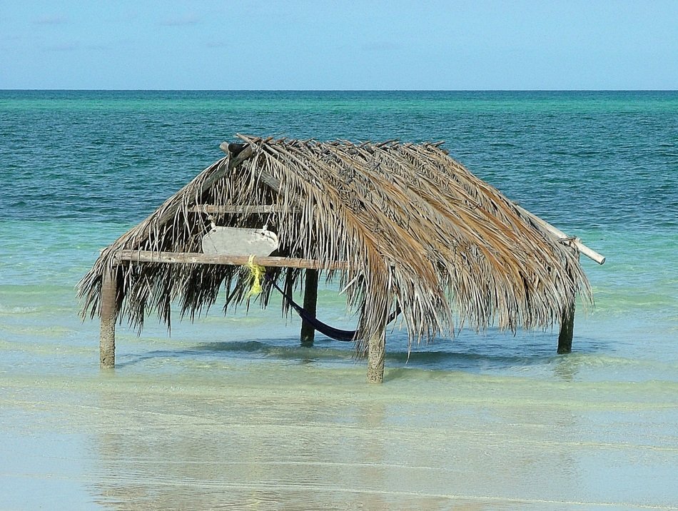 straw canopy at the edge of the sea