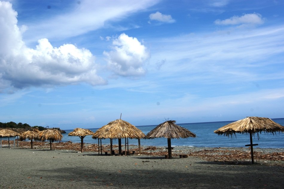 beach wooden umbrellas on the sand