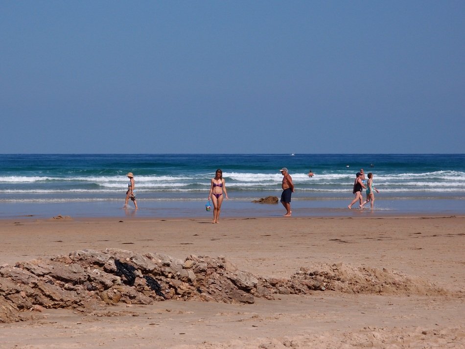 people on the beach in Cantabria