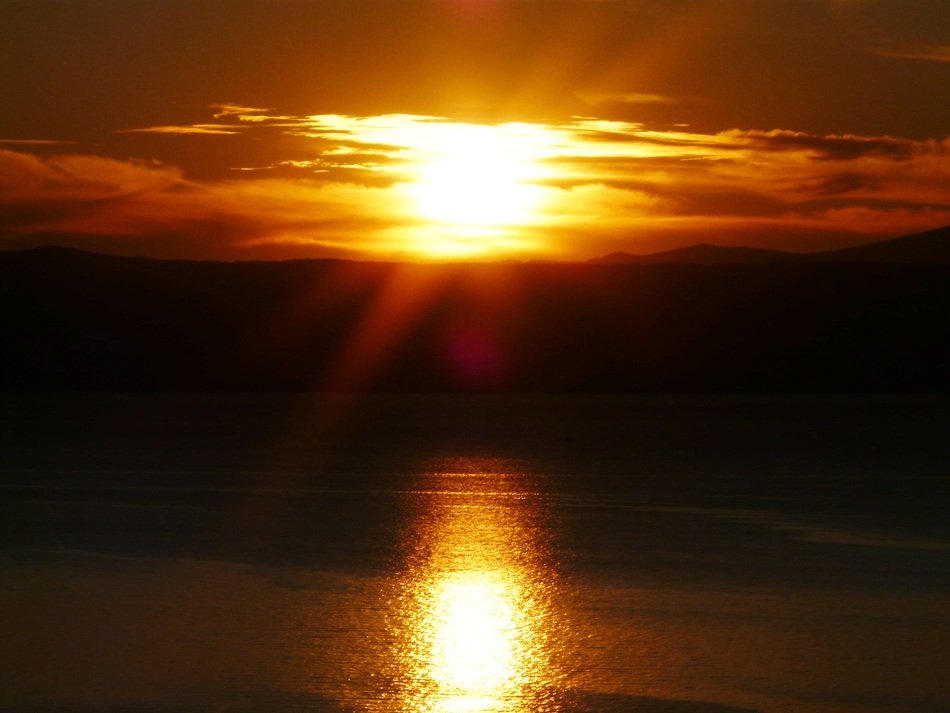 sunny path on the lake during sunset