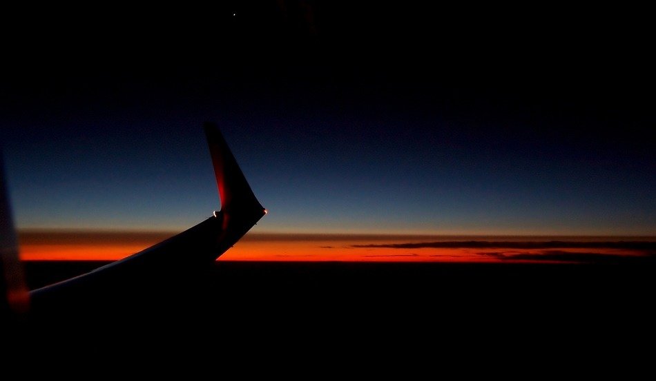 detail of aircraft at sunset sky