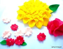 paper flowers on a white surface