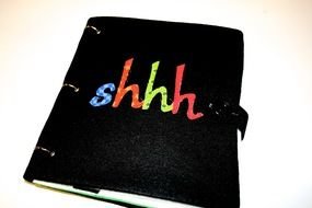 isolated black notebook