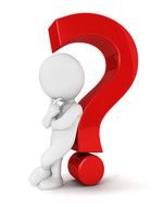 figurine of a man stands near a question mark