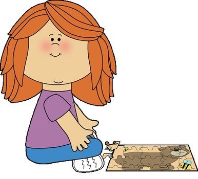 Girl Putting A Puzzle Together