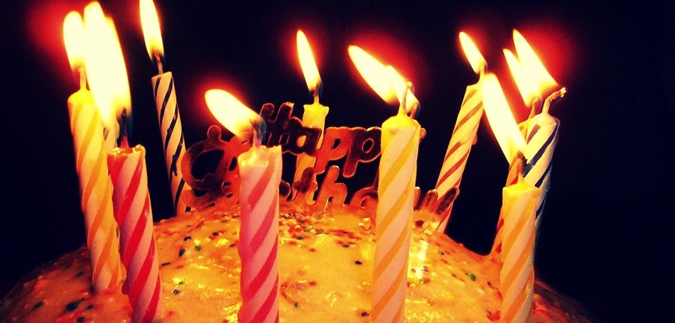 Photo of birthday cake in a dark