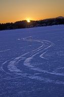 the traces of cars on the ice