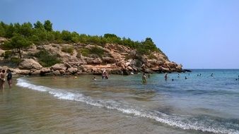 people swim near the beach