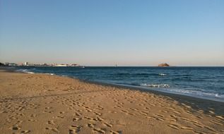 landscape of the footprints on a sea sandy beach