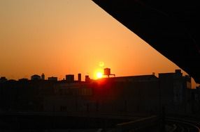 sunset over the water tower in brooklyn