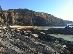 rocky beach in portugal on a sunny day