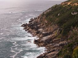 surf waves at the rocky shore