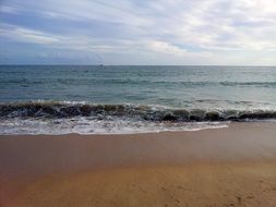 sea wave in the sand