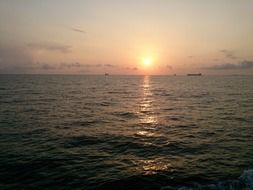 sunset sun over the water