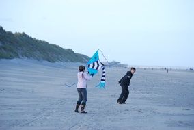 children play fly dragons