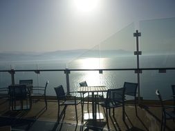 tables on the deck of a cruise liner