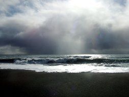 Coastline of the ocean against a background of thunderclouds