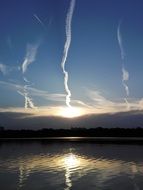stripes in the sky over the lake